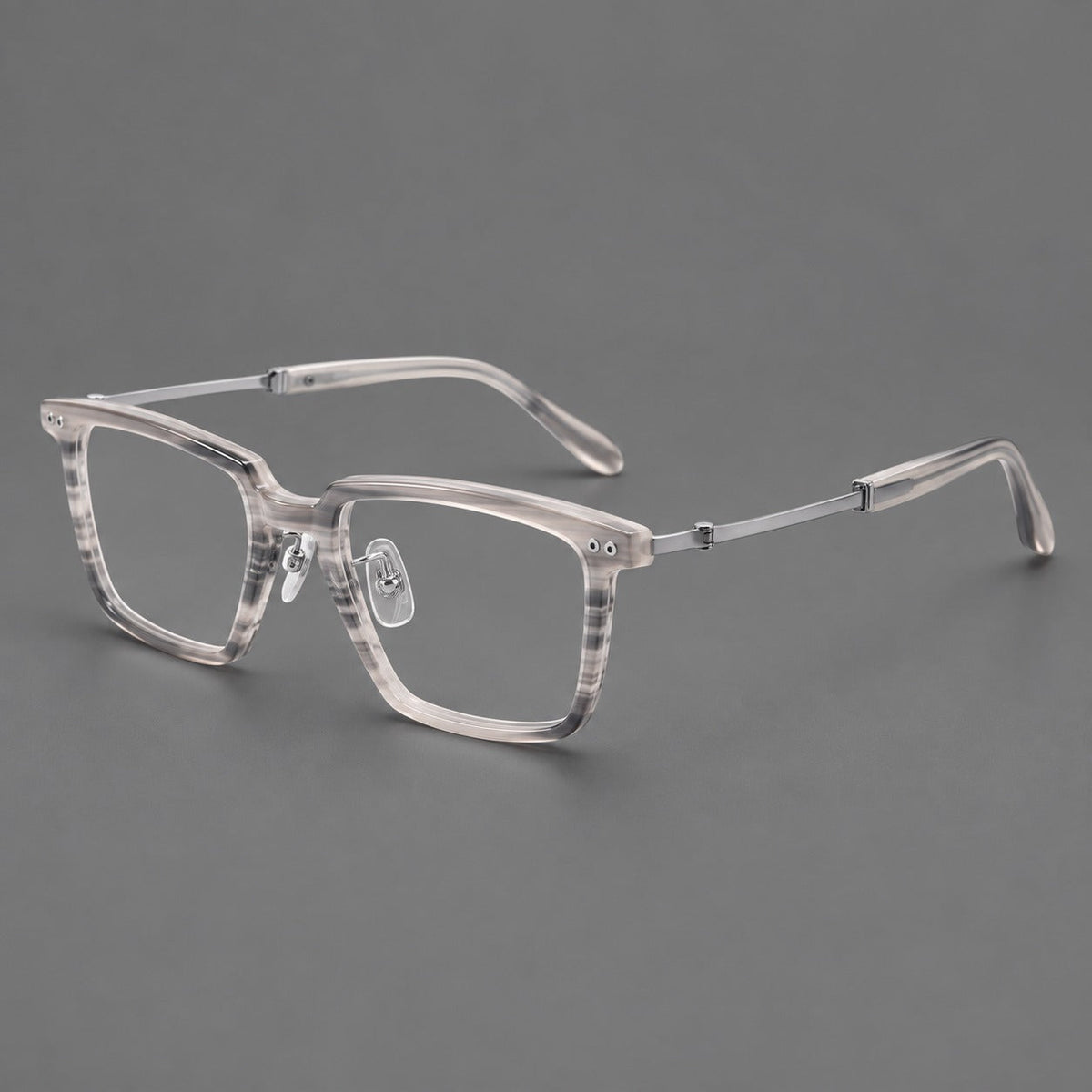 Classic acetate and titanium eyeglasses with a straight brow and rounded rectangular rims in Striped Gray / Silver, three quarter view