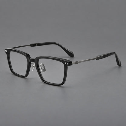 Classic acetate and titanium eyeglasses with a straight brow and rounded rectangular rims in Black / Brushed Gray, three quarter view lens detail