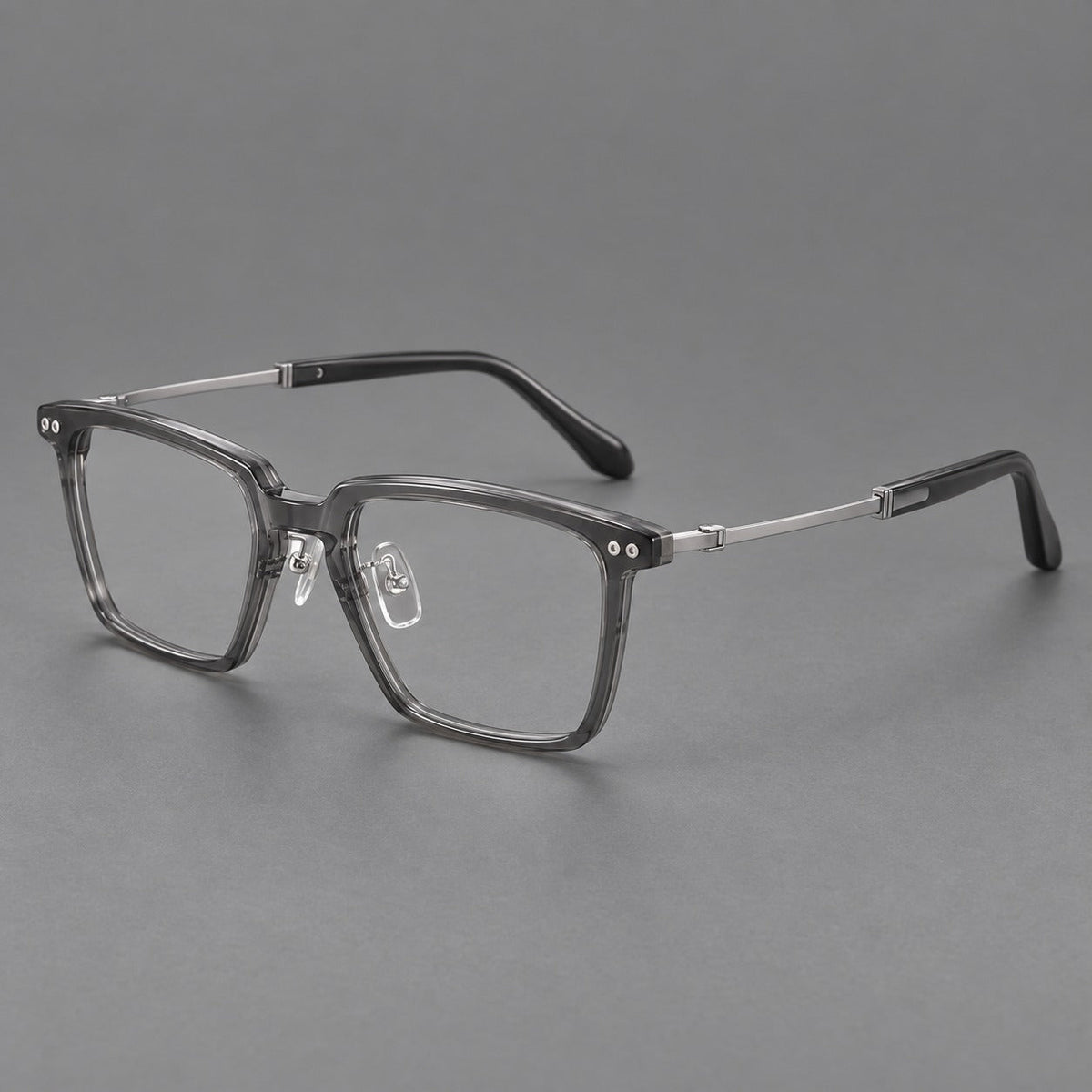 Classic acetate and titanium eyeglasses with a straight brow and rounded rectangular rims in Clear Gray / Silver, three quarter view
