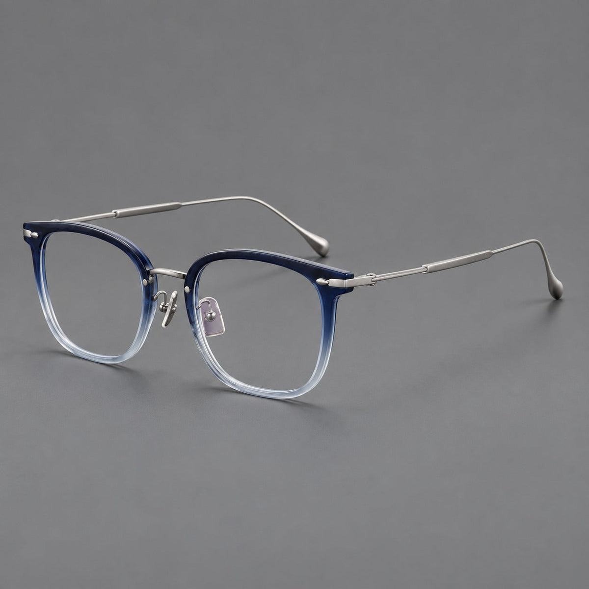 Retro square eyeglasses in acetate and titanium with rounded edges and sculpted corner accents in Blue Gradient / Silver, three quarter view