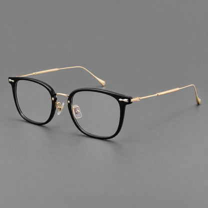 Retro square eyeglasses in acetate and titanium with rounded edges and sculpted corner accents in Glossy Black / Gold, three quarter view additional product view