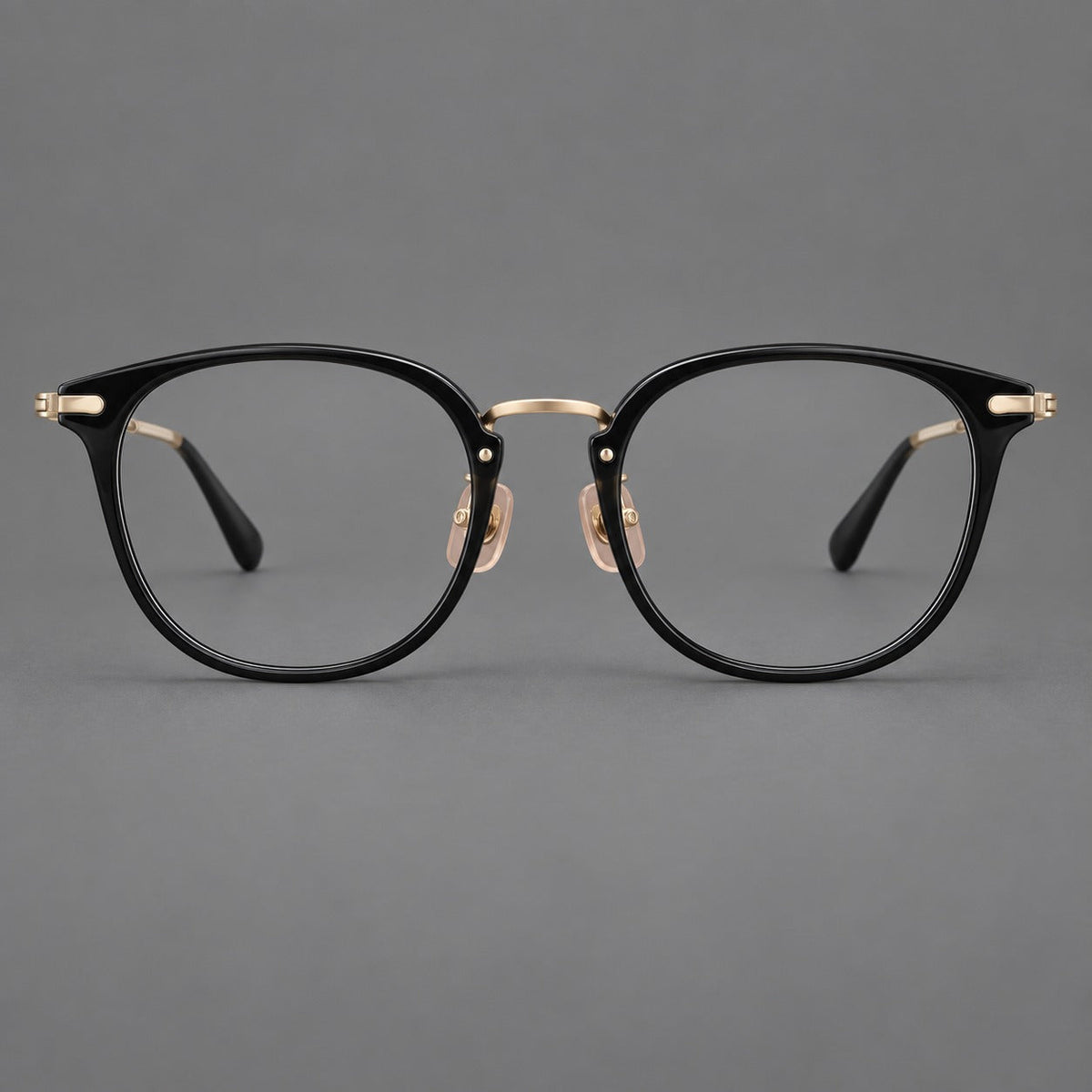 Classic soft square eyeglasses in acetate and titanium with engraved temples and corner accents in Glossy Black / Gold, front view