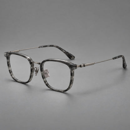 Soft square eyeglasses in acetate and titanium with wide upper corners and fine metal temples in Marbled Gray / Gunmetal, three quarter view front view