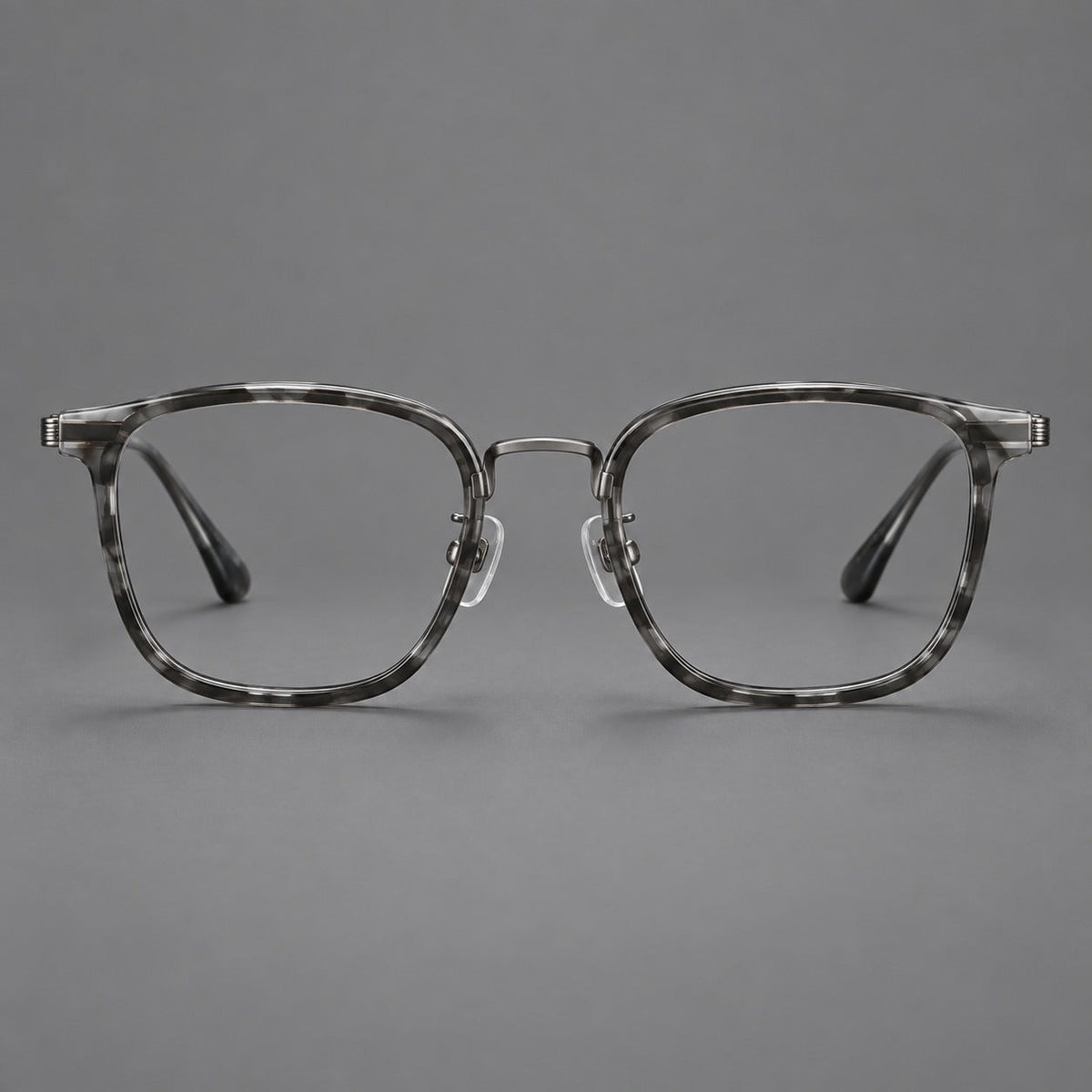 Soft square eyeglasses in acetate and titanium with wide upper corners and fine metal temples in Marbled Gray / Gunmetal, front view