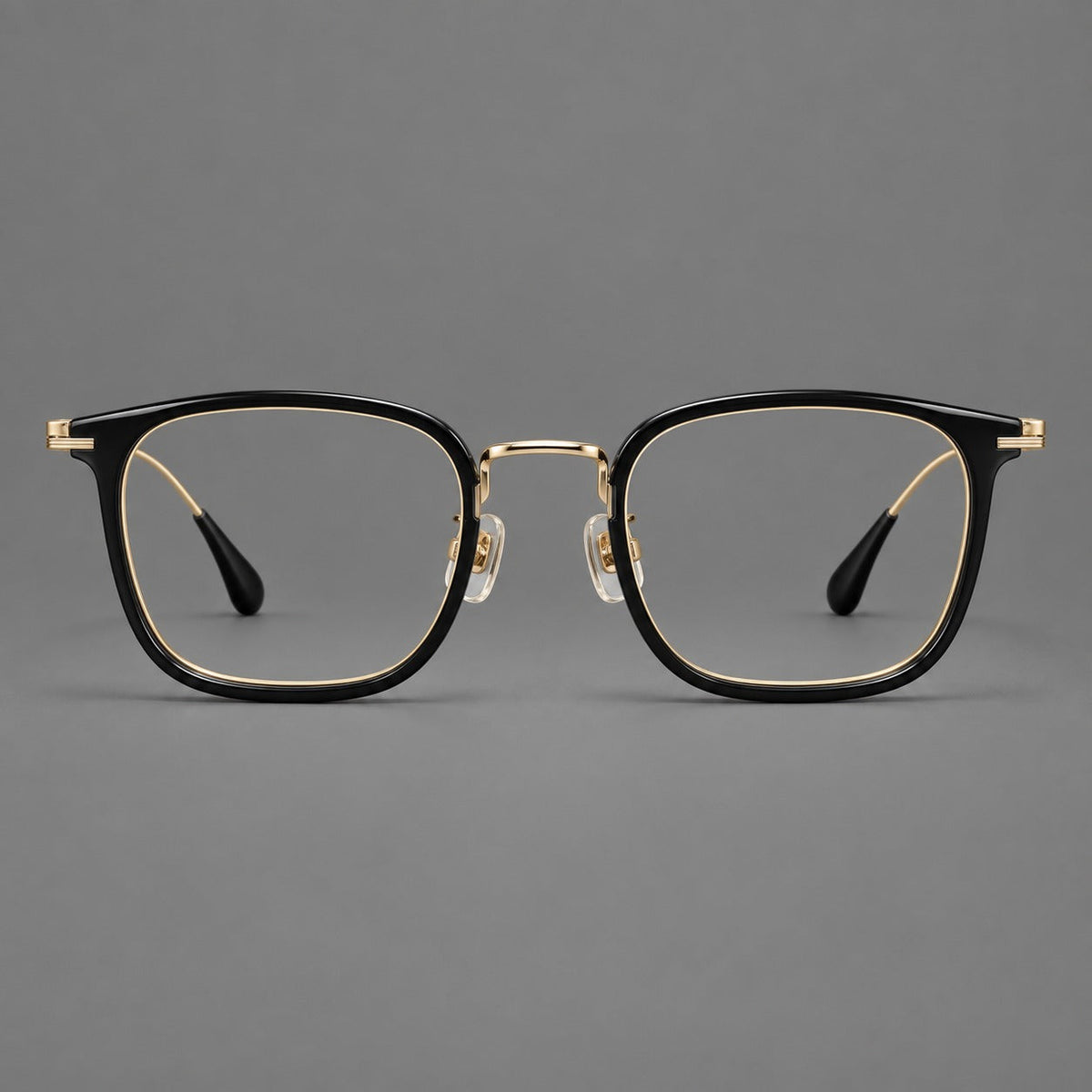 Soft square eyeglasses in acetate and titanium with wide upper corners and fine metal temples in Glossy Black / Gold, front view