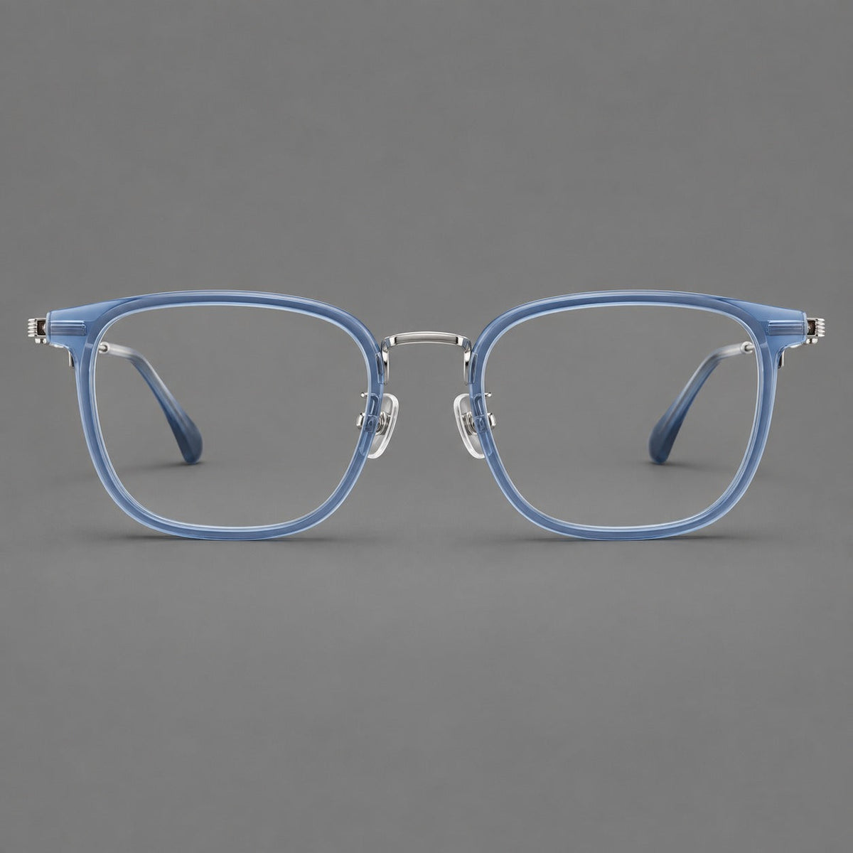 Soft square eyeglasses in acetate and titanium with wide upper corners and fine metal temples in Clear Blue / Silver, front view