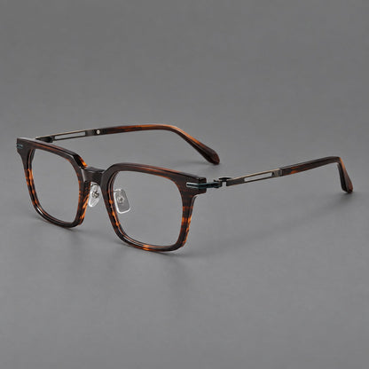 Modern acetate and titanium eyeglasses with angular square rims and curved metal hinges in Striped Brown / Antique Bronze, three quarter view front view