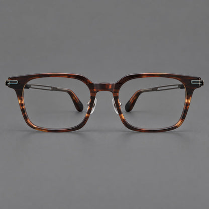 Modern acetate and titanium eyeglasses with angular square rims and curved metal hinges in Striped Brown / Antique Bronze, front view frame detail