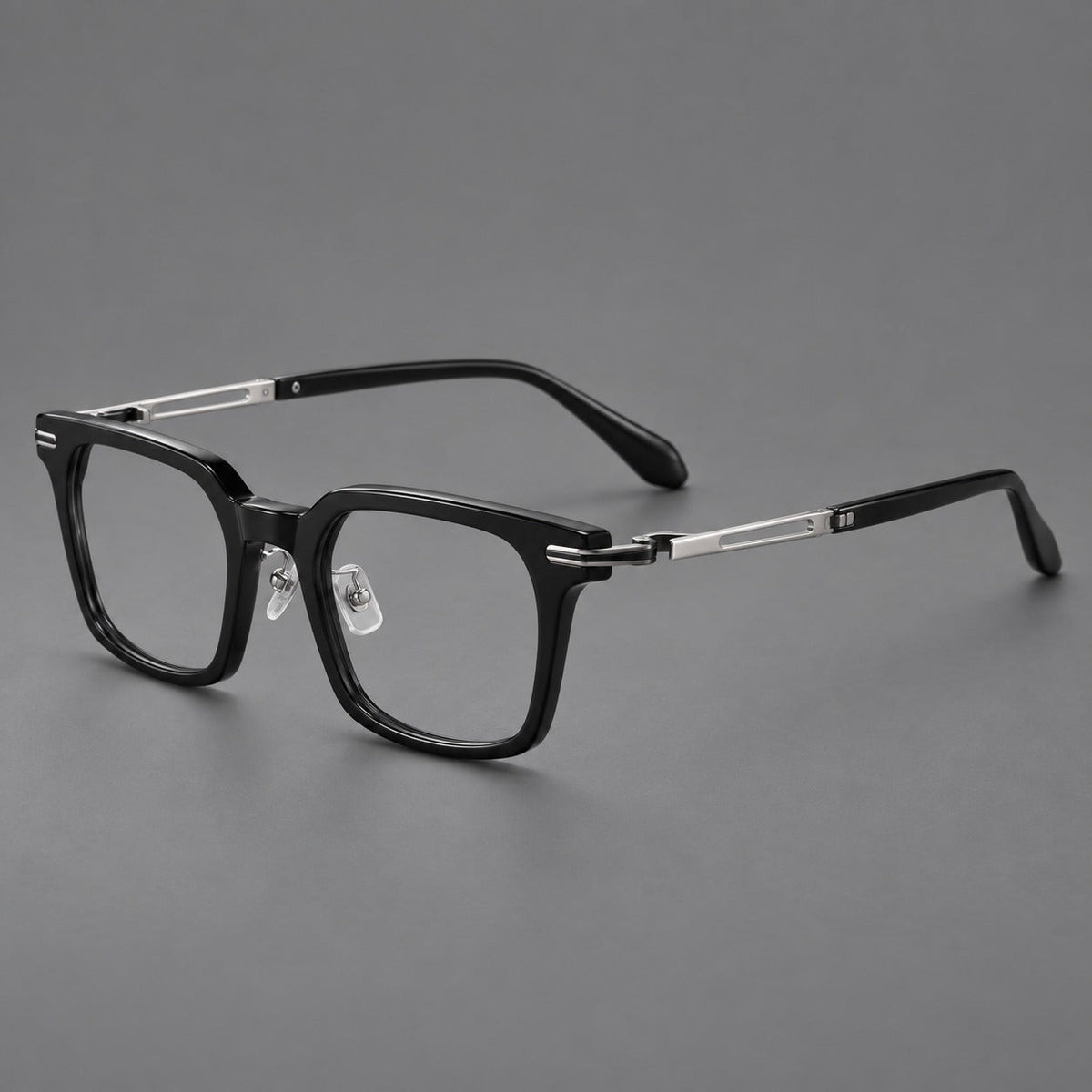 Modern acetate and titanium eyeglasses with angular square rims and curved metal hinges in Black / Silver, three quarter view