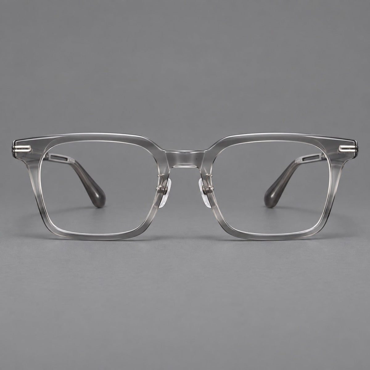 Modern acetate and titanium eyeglasses with angular square rims and curved metal hinges in Clear Gray, front view