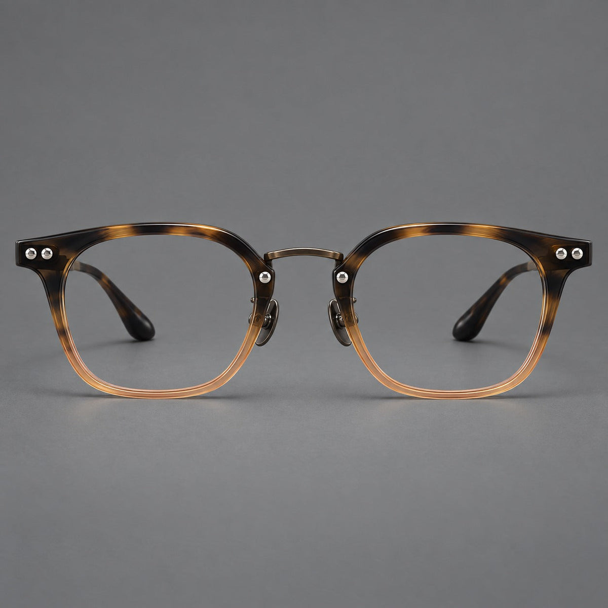 Retro acetate and titanium eyeglasses with softly rounded rims and a metal bridge in Tortoiseshell / Gunmetal, front view