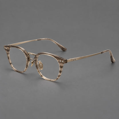 Retro acetate and titanium eyeglasses with softly rounded rims and a metal bridge in Light Gray Woodgrain, three quarter view lens detail