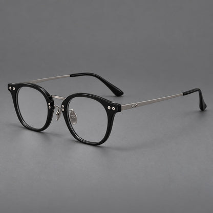 Retro acetate and titanium eyeglasses with softly rounded rims and a metal bridge in Black / Silver, three quarter view additional product view