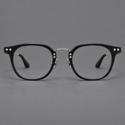 Retro acetate and titanium eyeglasses with softly rounded rims and a metal bridge in Black / Silver, front view additional product view