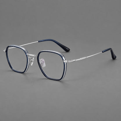 Soft square eyeglasses in acetate and titanium with slim rims and a finely engraved metal bridge in Blue / Silver, three quarter view front view