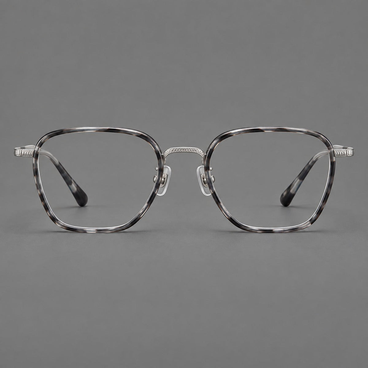 Soft square eyeglasses in acetate and titanium with slim rims and a finely engraved metal bridge in Gray Tortoiseshell / Silver, front view