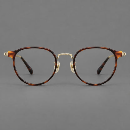 Round eyeglasses in acetate and titanium with widened outer corners and slender metal temples in Tortoiseshell / Gold, front view side view