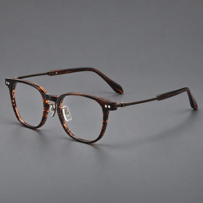 Vintage acetate and titanium eyeglasses with soft square rims and paired metal rivets in Striped Brown / Antique Bronze, three quarter view