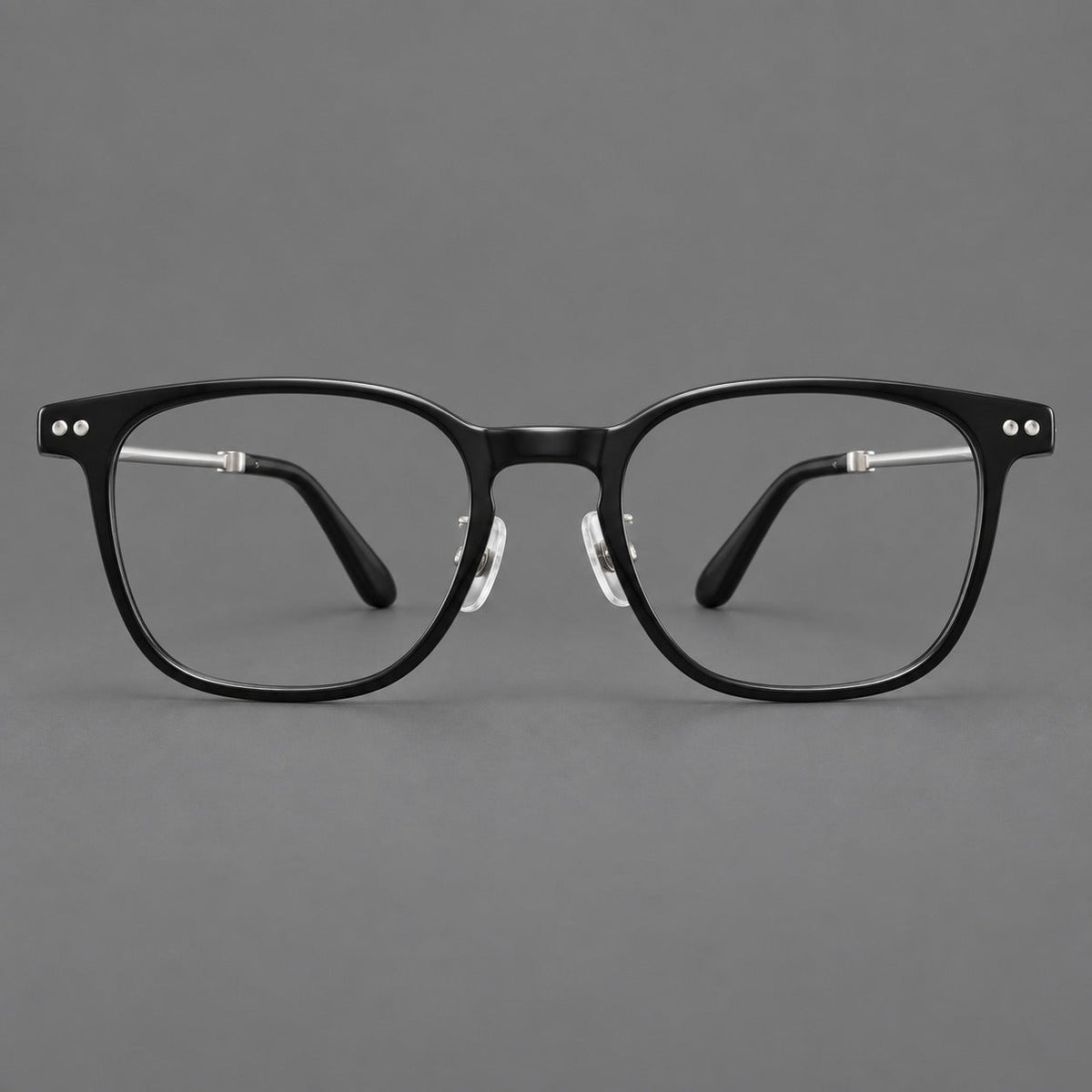 Vintage acetate and titanium eyeglasses with soft square rims and paired metal rivets in Black / Silver, front view