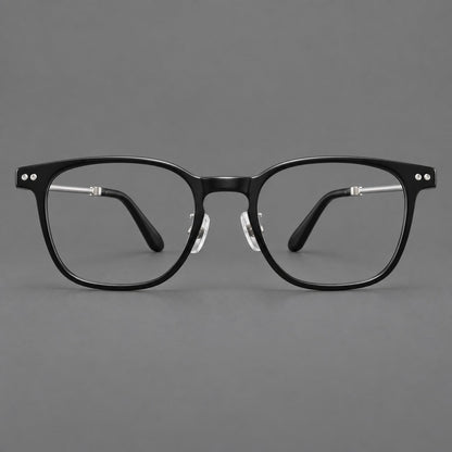 Vintage acetate and titanium eyeglasses with soft square rims and paired metal rivets in Black / Silver, front view frame detail