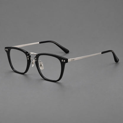 Acetate and titanium eyeglasses with soft square rims and an arched metal bridge in Black / Silver, three quarter view lens detail