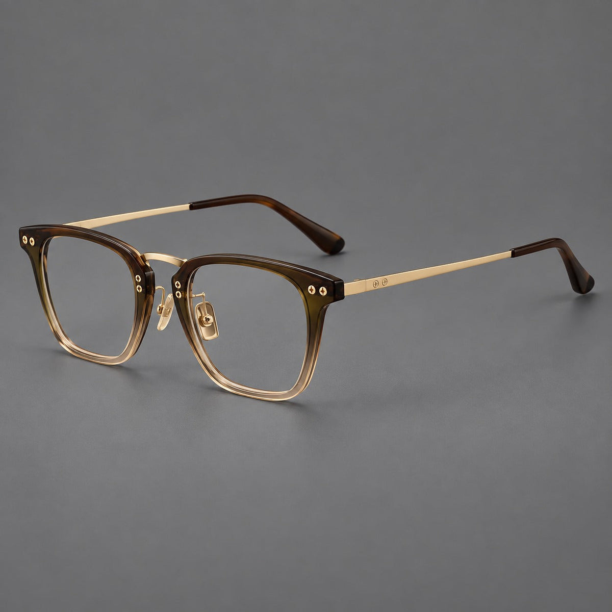 Acetate and titanium eyeglasses with soft square rims and an arched metal bridge in Tea Gradient / Gold, three quarter view