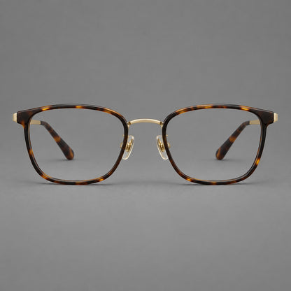 Rounded rectangular eyeglasses in acetate and titanium with bold corners and engraved metal temples in Tortoiseshell / Gold, front view side view