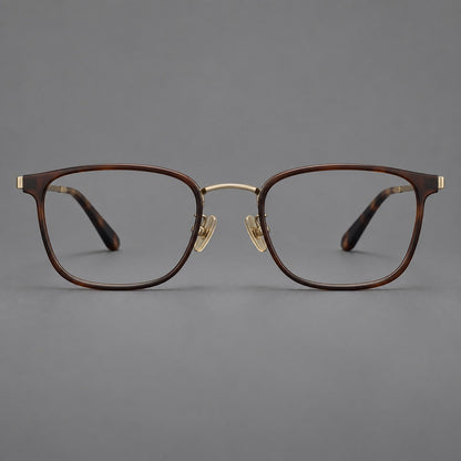 Rounded rectangular eyeglasses in acetate and titanium with bold corners and engraved metal temples in Coffee Brown / Antique Bronze, front view additional product view