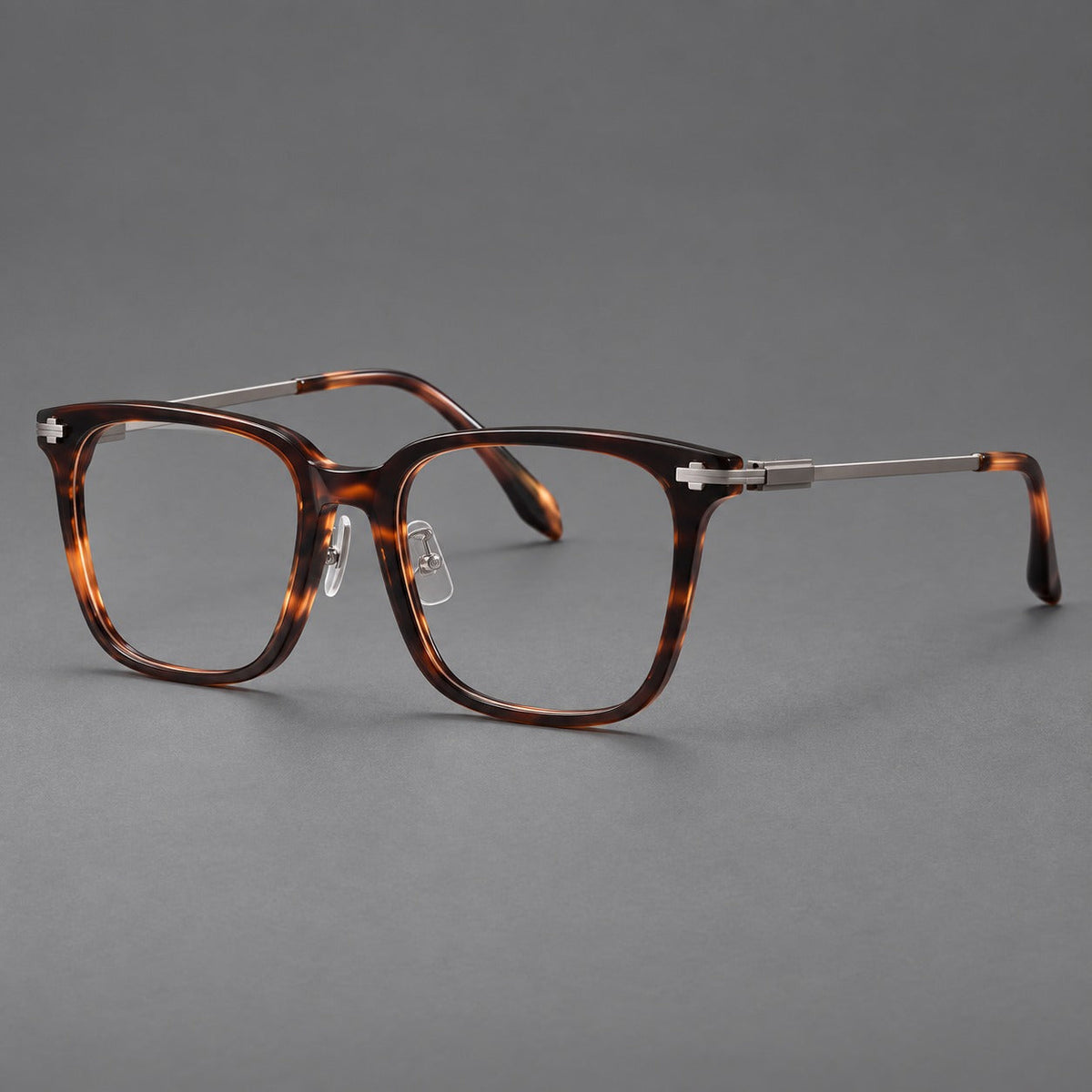 Classic acetate and titanium eyeglasses with broad square rims and textured metal temples in Tortoiseshell / Gray, three quarter view