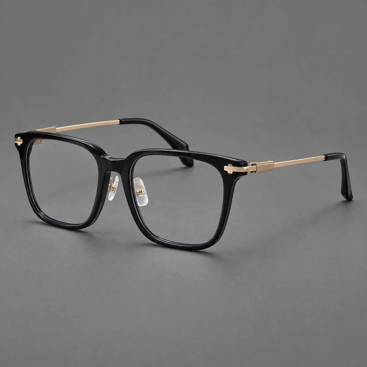 Classic acetate and titanium eyeglasses with broad square rims and textured metal temples in Black / Gold, three quarter view