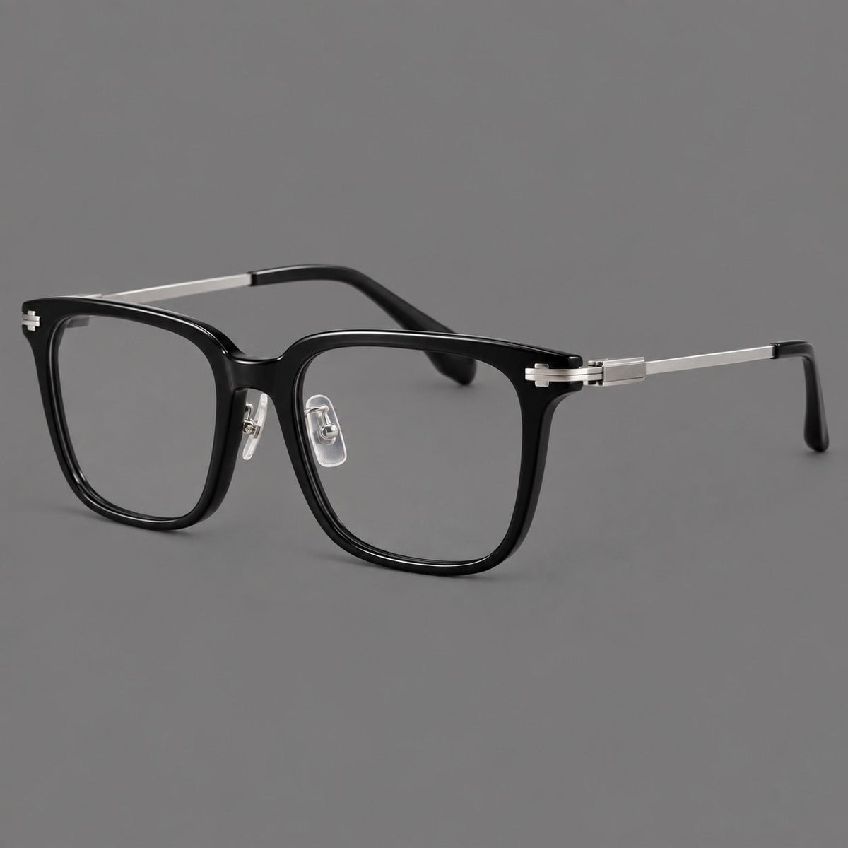 Classic acetate and titanium eyeglasses with broad square rims and textured metal temples in Black / Silver, three quarter view