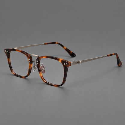 Acetate and titanium eyeglasses with angular rectangular rims and a curved metal bridge in Tortoiseshell / Gunmetal, three quarter view