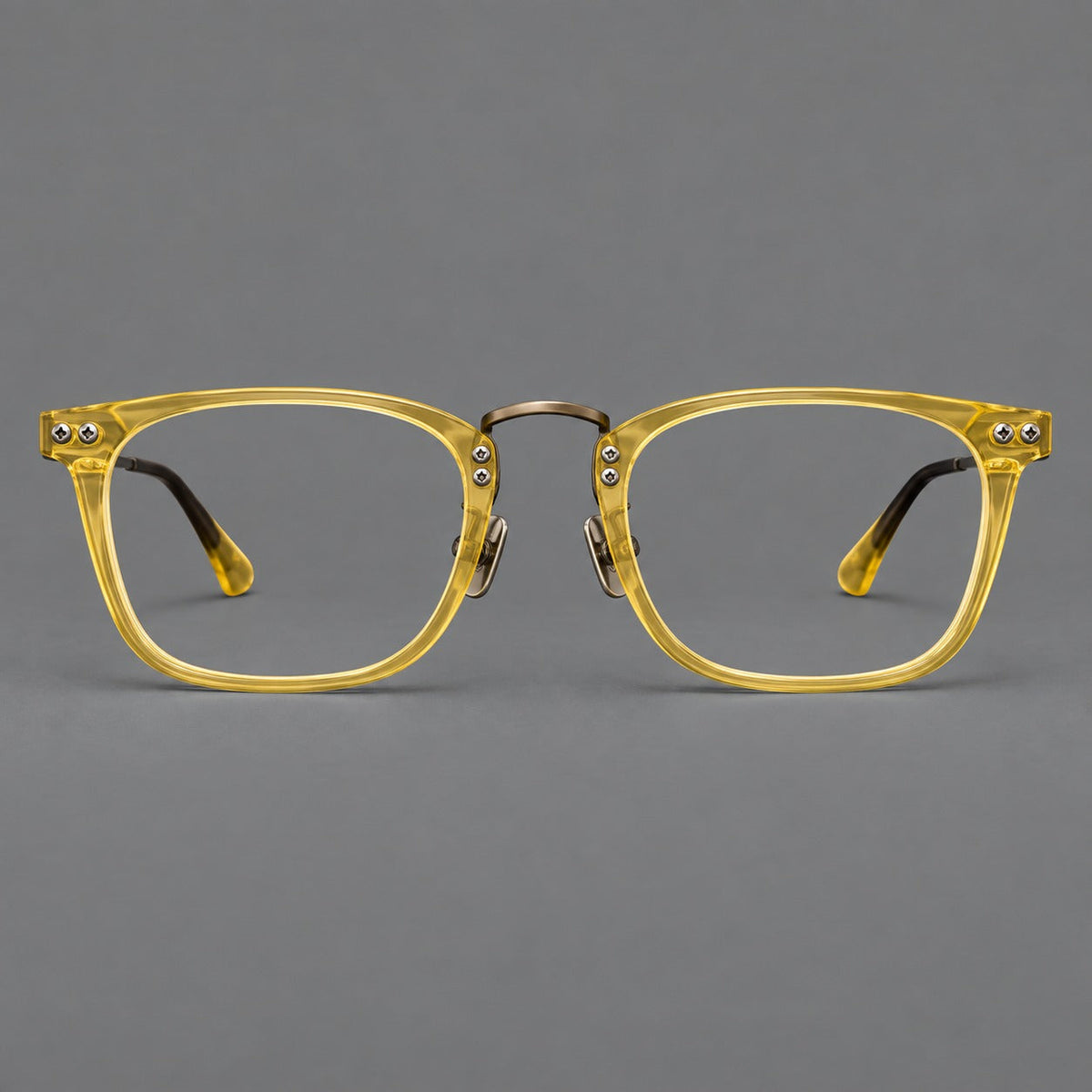 Acetate and titanium eyeglasses with angular rectangular rims and a curved metal bridge in Jade Yellow / Antique Bronze, front view