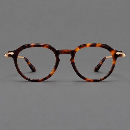 Retro acetate and titanium eyeglasses with panto rims and decorative arrow corner accents in Tortoiseshell / Gold, front view side view