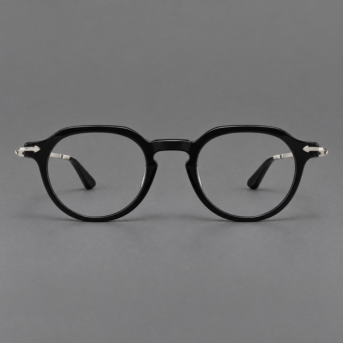 Retro acetate and titanium eyeglasses with panto rims and decorative arrow corner accents in Black / Silver, front view