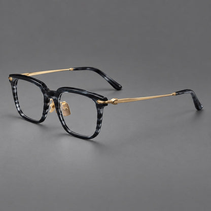 Bold acetate and titanium eyeglasses with rectangular rims and sculpted arrow accents in Gray Blue Woodgrain / Light Gold, three quarter view