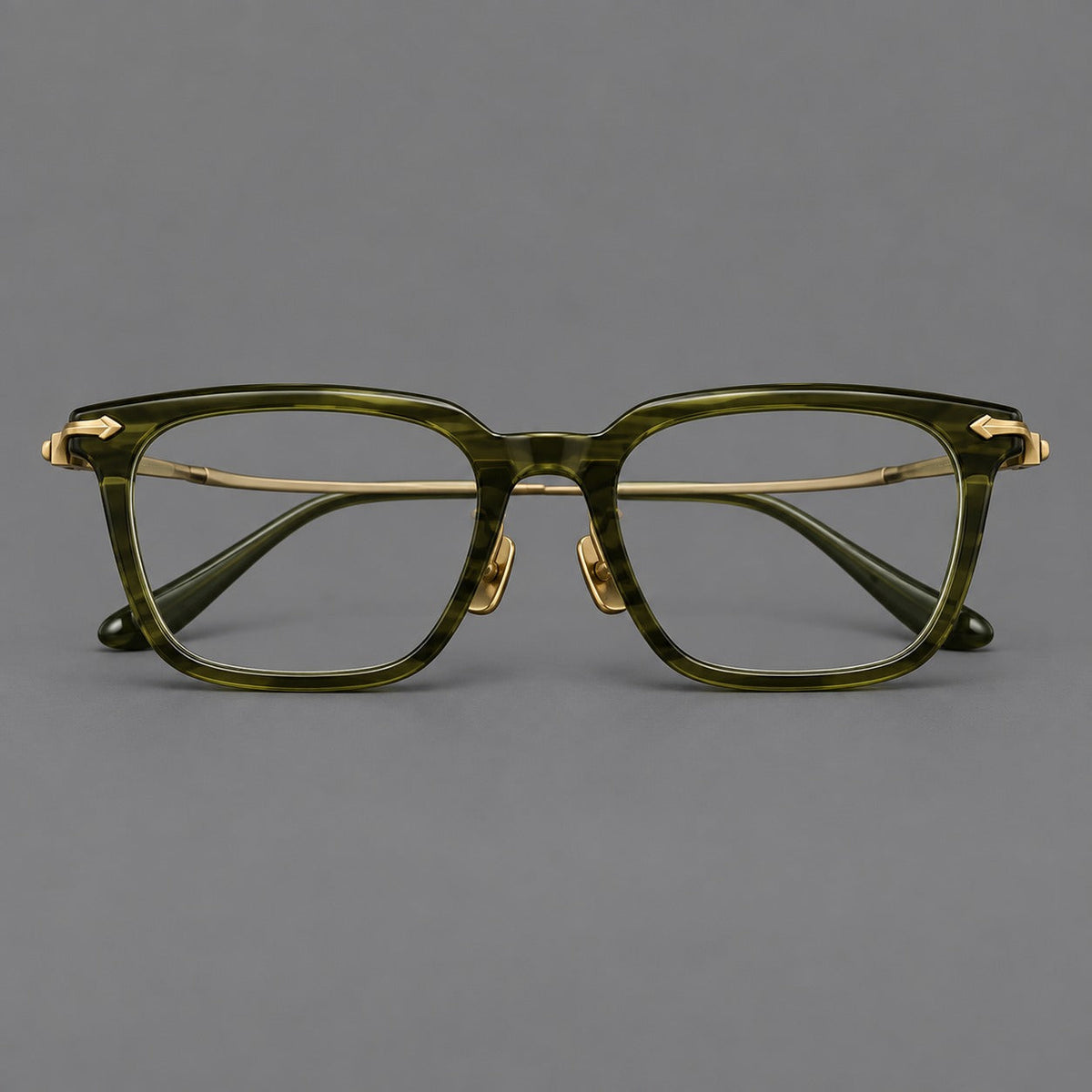 Bold acetate and titanium eyeglasses with rectangular rims and sculpted arrow accents in Army Green / Antique Bronze, front view
