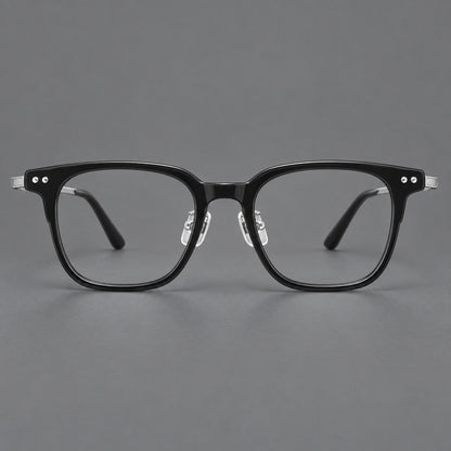 Classic acetate and titanium eyeglasses with squared brows and paired corner rivets in Black / Silver, front view frame detail