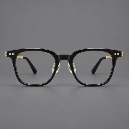 Classic acetate and titanium eyeglasses with squared brows and paired corner rivets in Black / Gold, front view temple detail