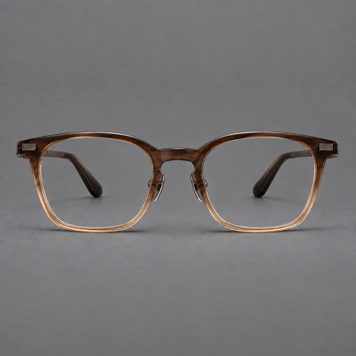 Classic acetate and titanium eyeglasses with rounded square rims and textured corner accents in Brown Gradient / Antique Bronze, front view