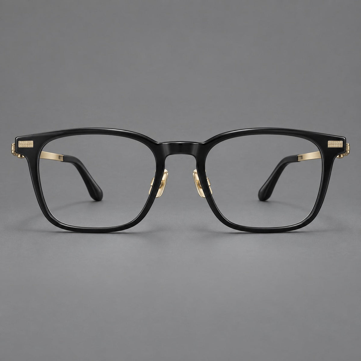 Classic acetate and titanium eyeglasses with rounded square rims and textured corner accents in Black / Gold, front view