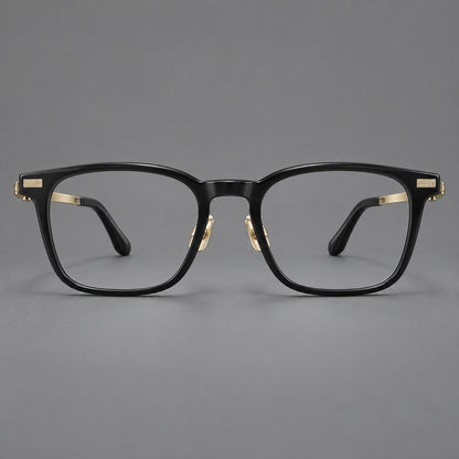 Classic acetate and titanium eyeglasses with rounded square rims and textured corner accents in Black / Gold, front view temple detail