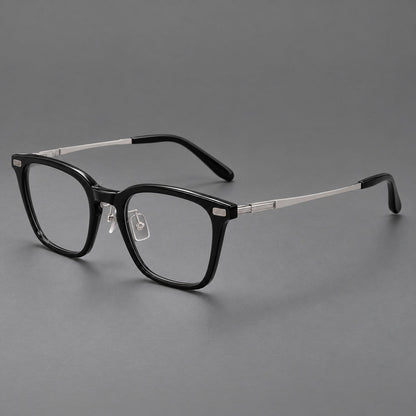 Classic acetate and titanium eyeglasses with rounded square rims and textured corner accents in Black / Silver, three quarter view additional product view