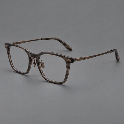 Classic acetate and titanium eyeglasses with rounded square rims and textured corner accents in Dark Gray / Antique Bronze, three quarter view additional product view