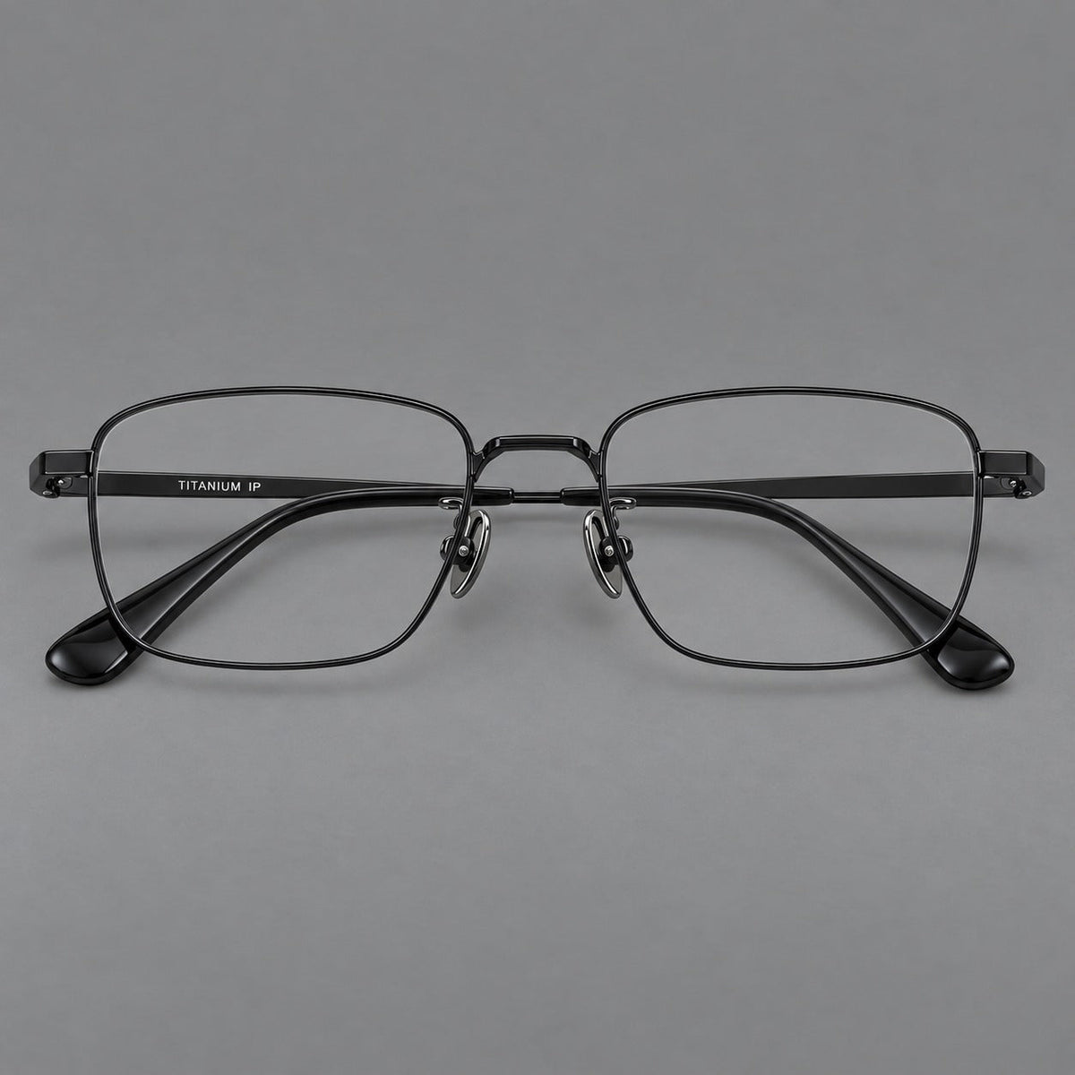 Modern square titanium glasses with an angular bridge and broad straight temples in Black, front view