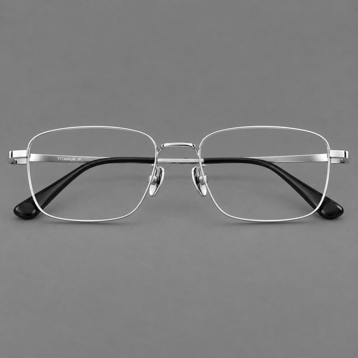 Modern square titanium glasses with an angular bridge and broad straight temples in Silver, front view