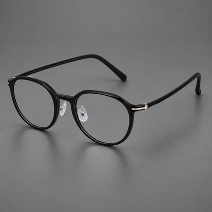 Retro round plastic eyeglasses with a curved bridge and slim metal corner accents in Glossy Black, three quarter view