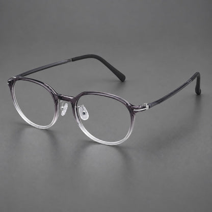 Retro round plastic eyeglasses with a curved bridge and slim metal corner accents in Ink Gray Gradient, three quarter view front view