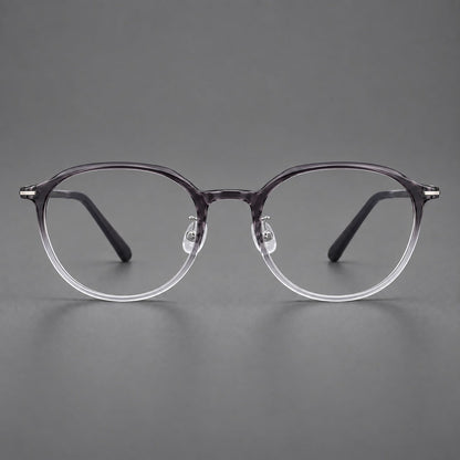 Retro round plastic eyeglasses with a curved bridge and slim metal corner accents in Ink Gray Gradient, front view frame detail