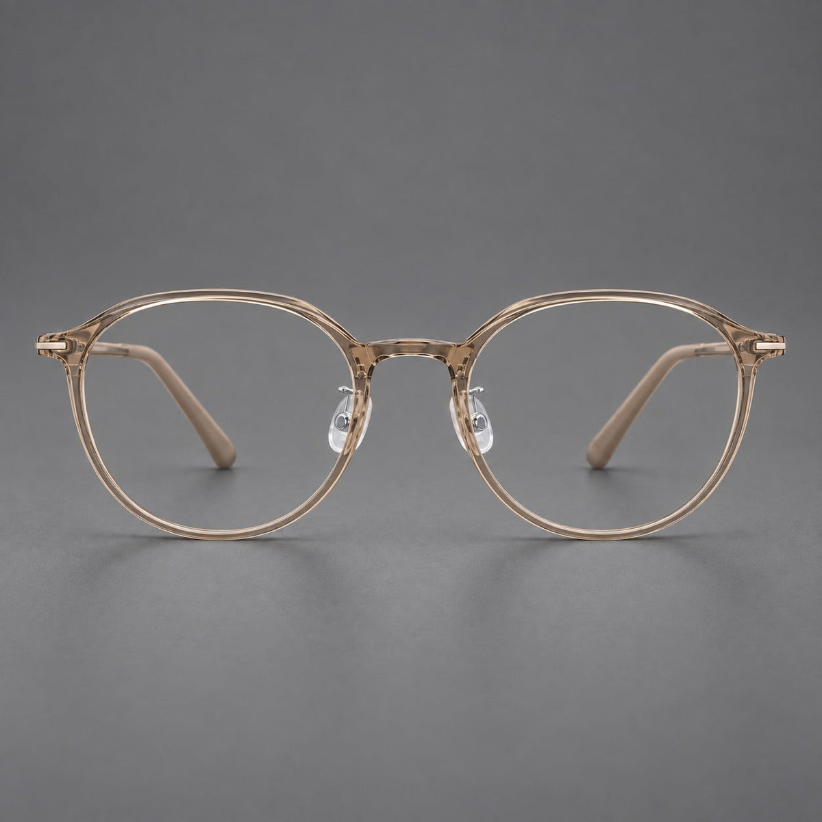 Retro round plastic eyeglasses with a curved bridge and slim metal corner accents in Tea, front view